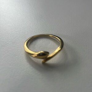 Gold snake ring with jeweled eyes